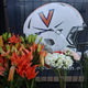 Flowers are placed at a memorial for the slain University of Virginia football players.